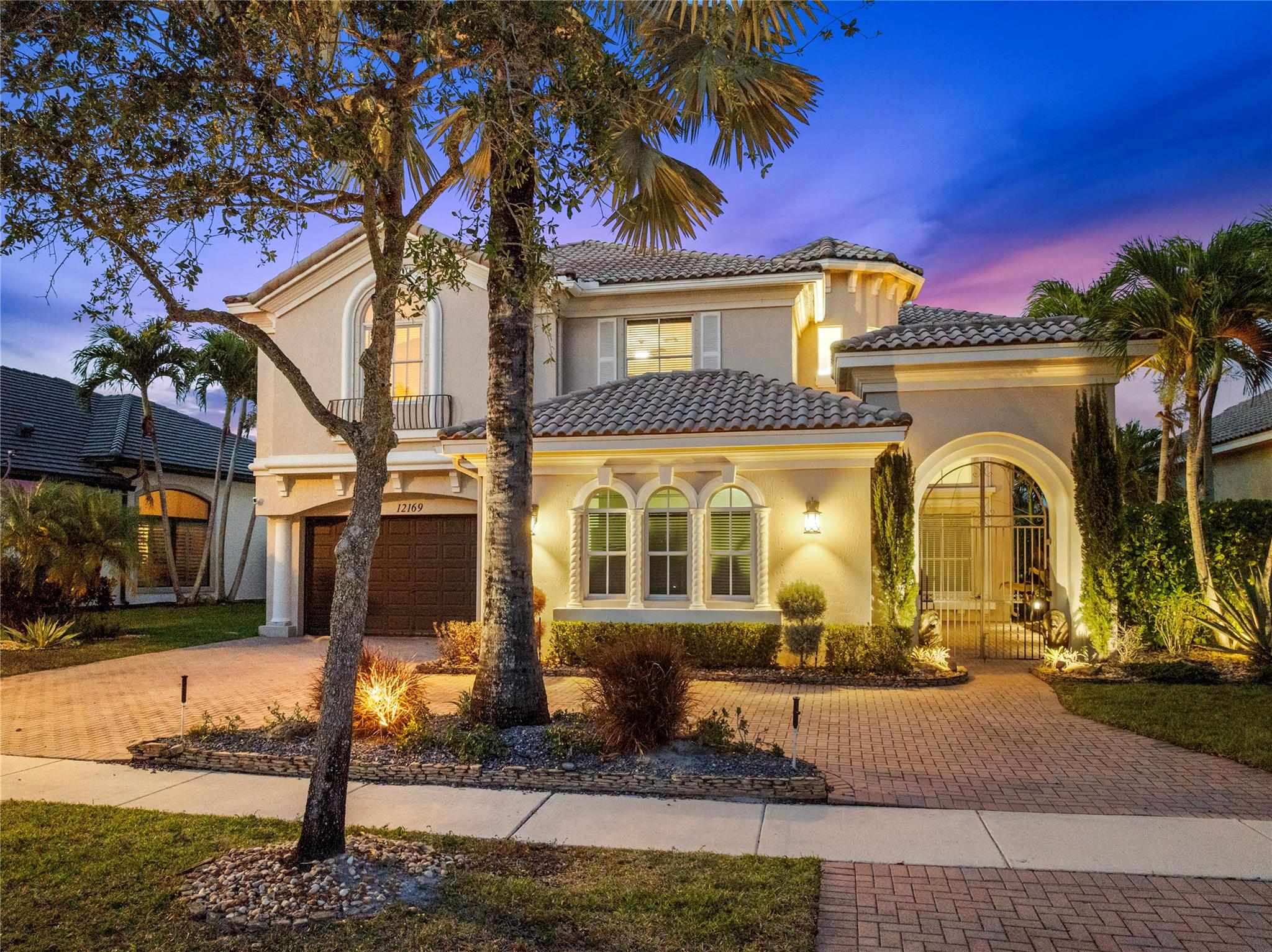 Stunning Essex Model Home Featuring 5 Beds & 3 Baths w/Courtyard Entry, Circular Driveway & Pool On A Waterfront Lot. Walk-Through Chef’s Kitchen w/Granite Counters, Island, Custom Backsplash, Wall Oven & Updated Appliances. Spacious Master Suite w/Sitting Area, Walk-In Closets w/Built-Ins, Dual Vanities & Sinks, Separate Tub & Wrap Around Shower & Covered Balcony Overlooking Pool & Lake Views. Full Bed & Bath Downstairs. Backyard Oasis w/Covered Lounge Area, Expansive Pool & Extended Checkered Stone Tile. Open Floor Plan Perfect for Entertaining w/Soaring Volume Ceilings & Stylish Updated Lighting and Fixtures Throughout. 24-Hour Guard Gated Community, Resort Style Amenities, 2 Clubhouses, Fitness Centers, Pool & Spa, Tennis, Basketball, Low HOA Dues & Much More! Close to A+ Rated Schools