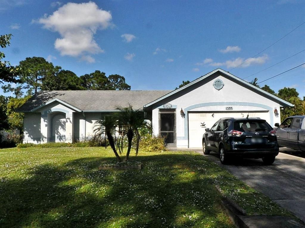 Photo of 1533 SW Flagami Road, Port Saint Lucie, FL 34953 (MLS # R10746294)