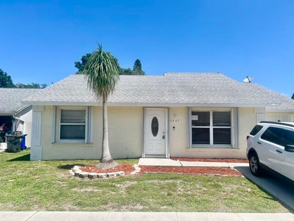 Photo of 5447 Twin Oakes Road, Greenacres, FL 33463 (MLS # B26026375)