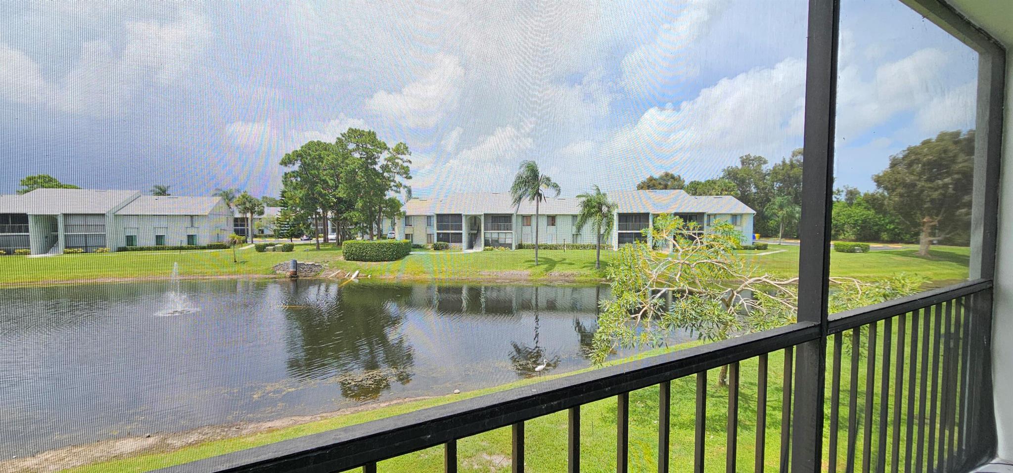 This move-in-ready home offers resort-style living. Your Condominium comes as a fully furnished 2-bedroom, 2-bathroom in beautiful West Palm Beach. This unit offers serene lake views from an oversized screened balcony, providing a relaxing setting overlooking both the water and fountain. Newer appliances include an air fry-convection oven, a Kitchen Pantry, Both Bathrooms have been remodeled, and there is ample storage throughout, including a walk-in closet in the primary bedroom and extra hallway storage. A full-size washer and dryer conveniently located inside the unit.Residents will appreciate additional building amenities such as a designated vehicle wash area, a large pool, and a Jacuzzi. The property is centrally located in West Palm Beach, close to I-95, the Turnpike, beaches,