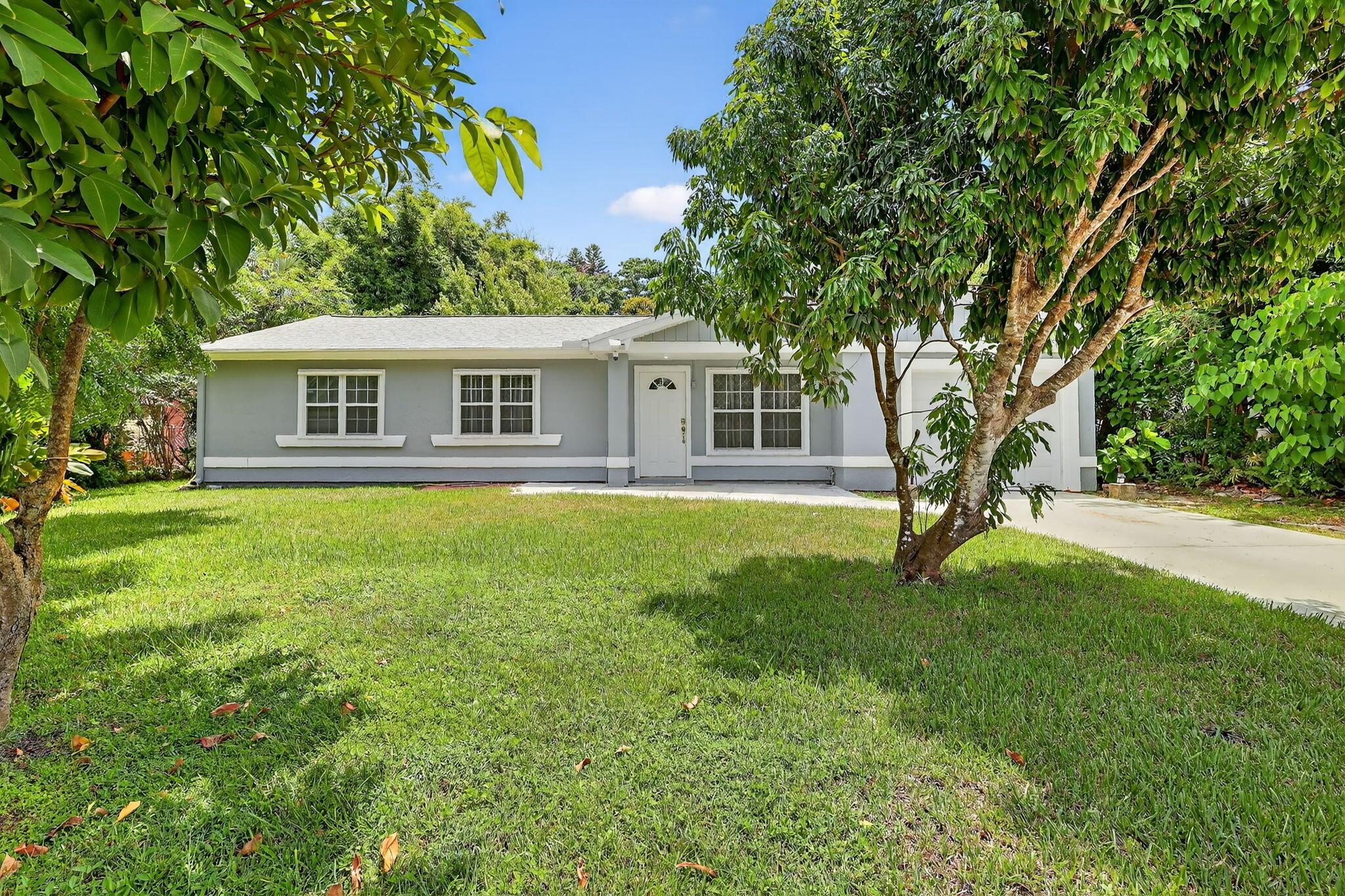 Spacious 4 bedroom, 3 full bath home with over 2300 living sqft and with two master suits. This remodeled and modernized home comes with all new quality fixtures and furnishings throuhout. Features a mother-in-law suite, formal living, formal dining with bar / coffee area, hugh 18x18 family / game room and utility room. Great floor plan with a set up that can house two separate families if needed. Home sits on a 1/3 acre lot with plenty of roof for a pool AND comes with a garden full of tropical and exotic fruit trees such as passion fruit, star fruit, soursop, jackfruit, mango, leache, Phillipino Apple and more, contributing to a private & paridise feel. Centrally located and close to everything. Minutes from downtown, beach, mall, shops, turnpike and I-95. Roof 2024, AC 2022. Must see