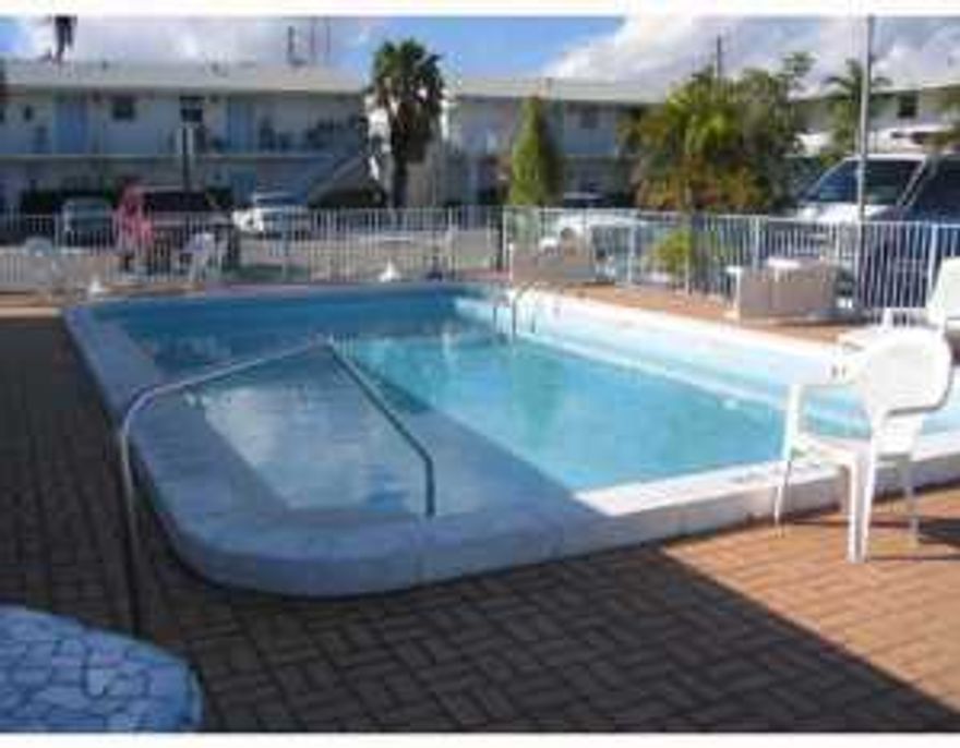 Nice second floor 2 bedrooms 2 baths end unit in Northern Lake Worth. Small community with a pool, saunas and a clubhouse, 2 assigned parking spaces, in walking distance to shops and restaurants.