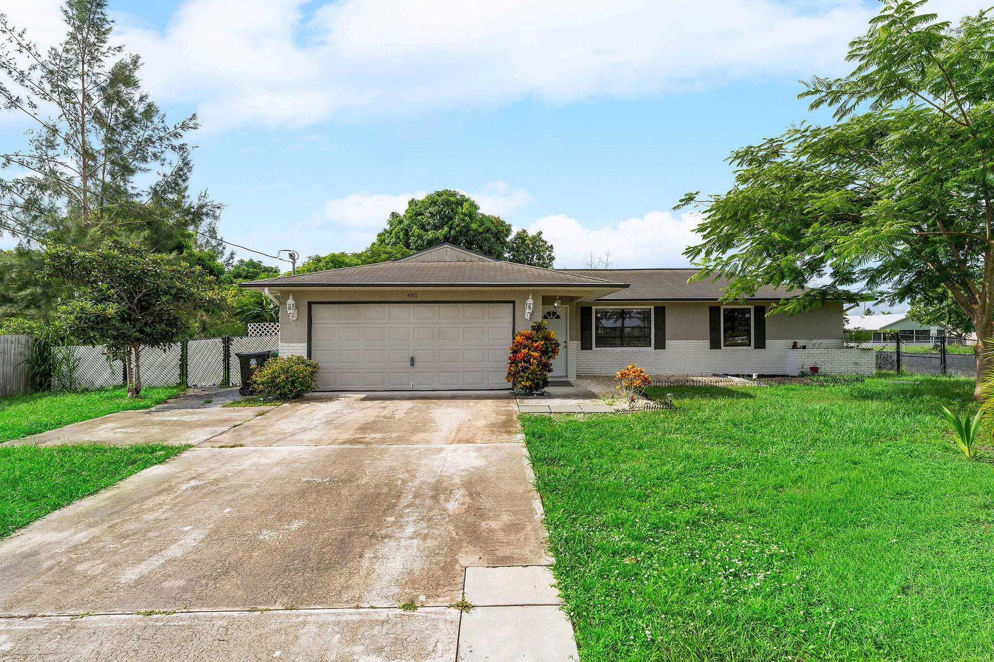 Welcome to your dream home in Port St. Lucie! This beautifully updated home, with renovated kitchen and bathrooms, lots of windows and sliding doors for views of the huge backyard. Located just minutes from I-95 /Turnpike, and all of your favorite shopping spots, this is the flexible Florida lifestyle you've been looking for! Sellers are very motivated bring your best offer forward. Sellers are willing to contribute $5,000 towards buyers closing cost with a full price offer.
