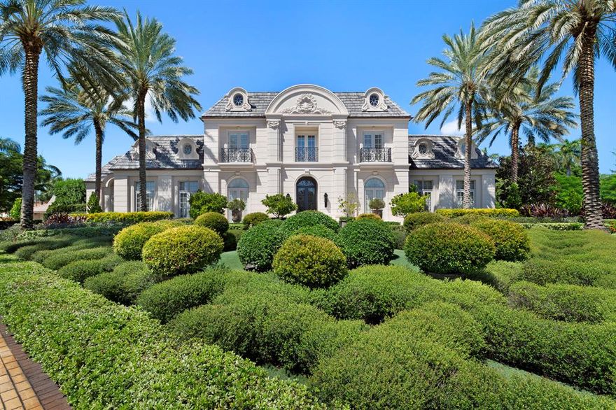 Offered Fully furnished negotiable! A manicured formal Renaissance garden, reminiscent of a 17th century royal retreat, is flawlessly blended with its tropical setting. A formal marble reflecting pool is set among an allee of Bougainvillea, walking paths, all surrounded by fifty+ varieties of native and exotic plants. An oversized sun-splashed heated swimming pool with fountain, separate circular spa, expansive covered poolside loggia with snack bar, and circular motor court with ample parking complete this 1.21+/--acre property.