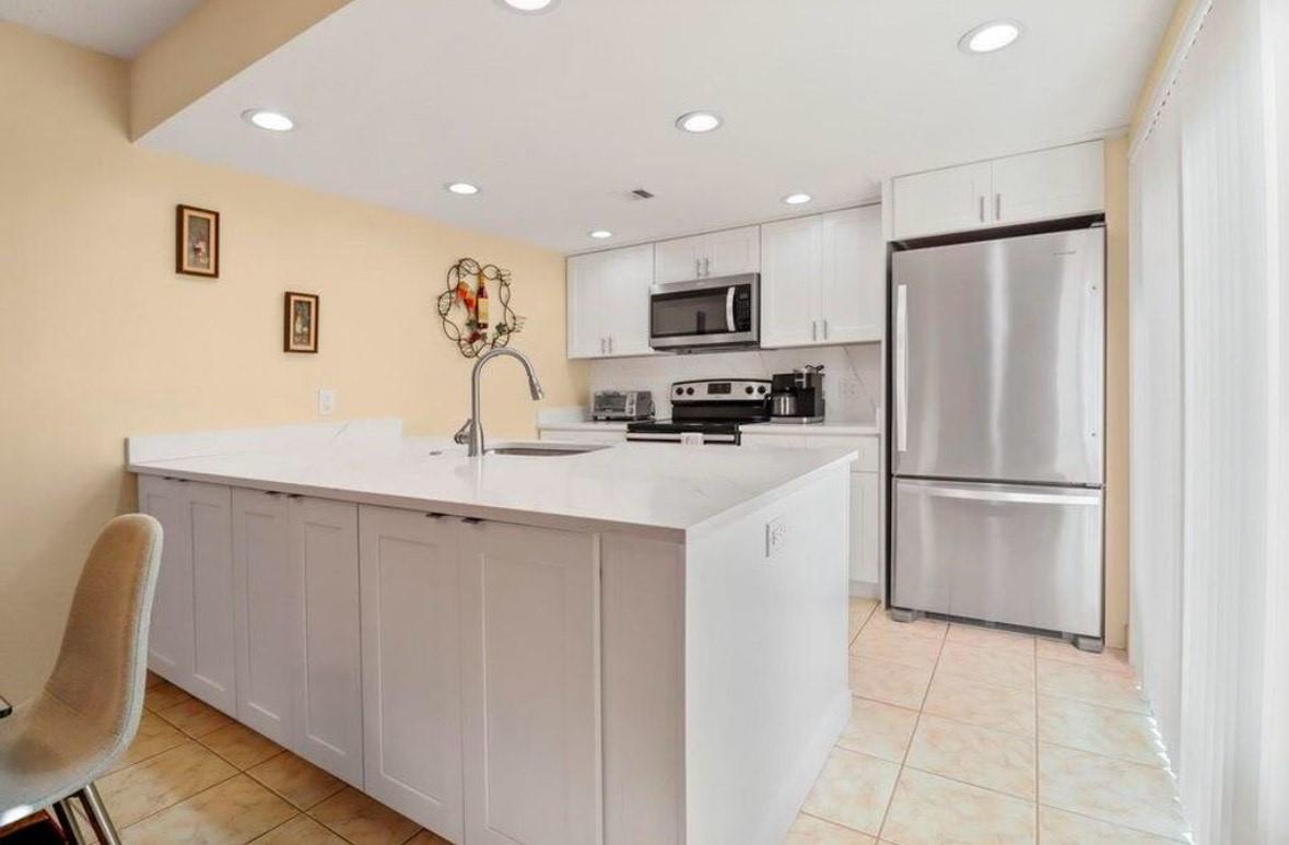Welcome to this 2-bedroom, 2.5-bath townhouse in the sought-after Village of Sandalwood Lakes. Enjoy a private fenced patio, perfect for BBQs or relaxing evenings, and a bright, open layout with a newly renovated kitchen featuring stainless steel appliances plus a washer/dryer. The community offers parks, tennis courts, pools, and plenty of green space for an active lifestyle. With quick access to I-95, you’re just minutes from the airport, downtown West Palm, Brightline, shopping, dining, and golf. This home blends comfort, convenience, and location—ideal for enjoying everything West Palm has to offer. Come see for yourself!