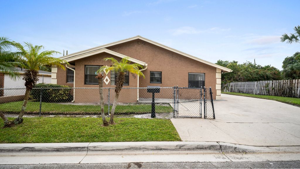 Photo of 1233 W 32nd Street, Riviera Beach, FL 33404 (MLS # R11145484)