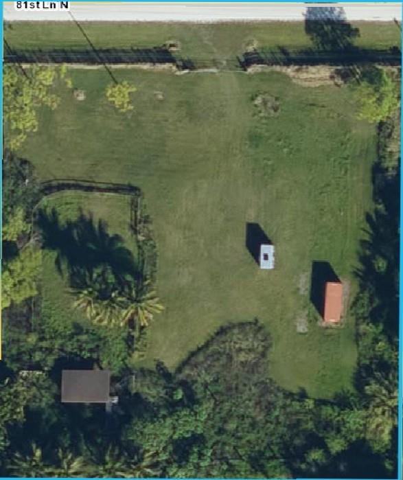 The property is vacant, cleared, filled, fenced, has electric and 2 wells. Small poll barn on the property.