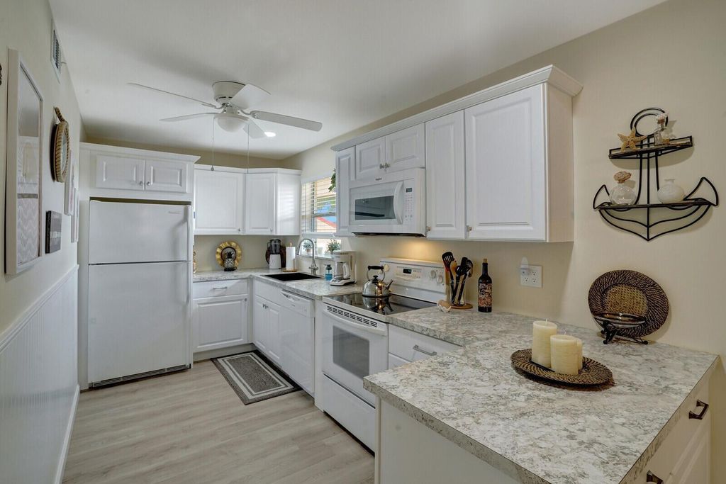 Photo of 319 Lake Evelyn Drive, West Palm Beach, FL 33411 (MLS # R10908856)
