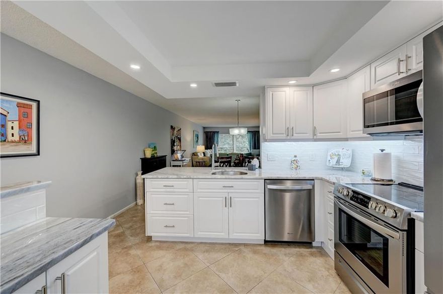 AMAZING 2BEDROOM/2BATH IN MINT CONDITION! BEAUTIFULLY RENOVATED CONDO WITH NEW WHITE KITCHEN CABINETS. OPEN CONCEPT WITH QUARTZ COUNTERTOP + STAINTLESS STEEL APPLIANCES. CERAMIC FLOORS THROUGH-OUT. RENOVATED BATHROOMS WITH NEW VANITIES + MIRORRS + TOILETS + FAUCETS. A/C (2015) WATER HEATER (2017) + NEW VALVES. SCREEN PATIO WITH SHUTTERS OVERLOOKING THE PORTOFINO POOL + GARDEN. FANS IN EVERY ROOM. 1 ASSIGNED PARKING SPACE. LAUNDRY ROOMS IN BUILDING ARE FREE. ASSOC REQUIRES 20% DOWN & 1 OCCUP 55+ OWNER OCCUPIED/CLICK ON SHOWING ASSIST