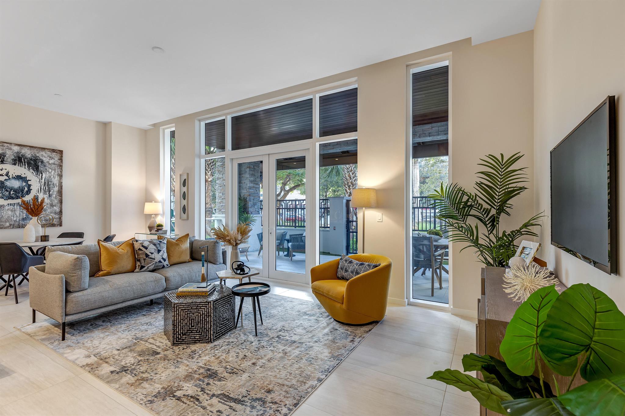 Available for occupancy November 1, 2025. Enjoy full service resort style living in Boca Raton's newest luxury building- ALINA Residences. This first floor 2 bed/ 2 bath villa with private outdoor loggia opens (via secure fob gate) to Mizner Blvd in the heart of downtown. Surround yourself with tropical landscaping in bright and airy decorator furnished (turnkey) villa. Interior features: floor-to-ceiling-windows, 11' ceilings, Italian porcelain flooring, luxurious kitchen with Miele appliances open to living room. Exquisite master bath with glass shower and soaking tub. Gorgeous outdoor area large enough to entertain guests with beautiful planked ceiling. Alina is a full service guard gated building with valet, doorman and on site management.