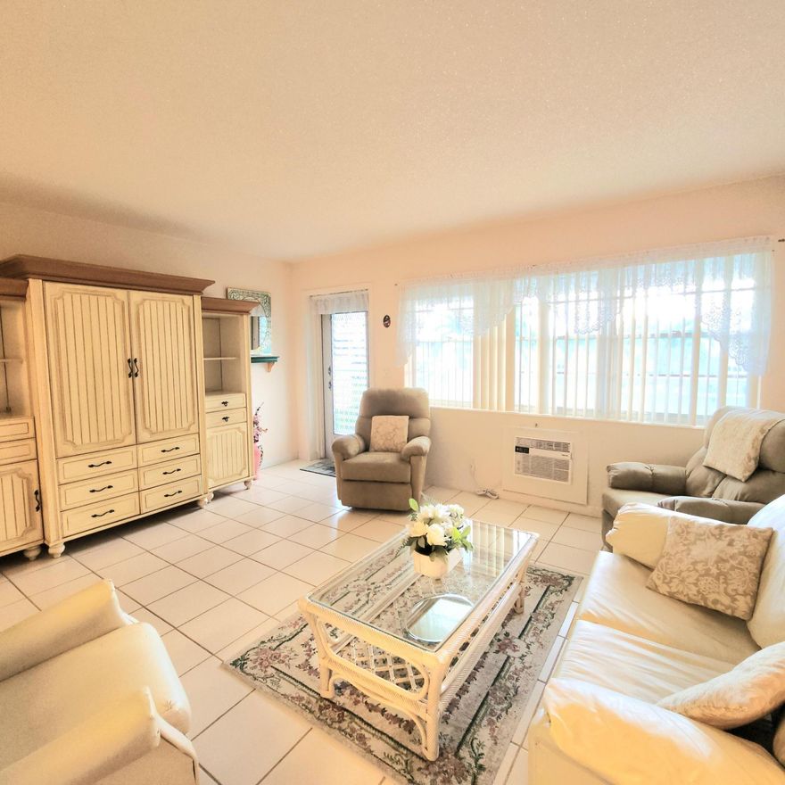 Great value for this sparkling professional cleaned condo. Walk in the front door to a bright and cheery living room then to your spacious dining area, off to the side is your spotless kitchen with plenty of prep space. The unit is equipped with utensils, plates and glasses. Just bring your personal belongings. The hallway has a walk in closet/pantry. Large comfy bedroom with walls of closets. Tile throughout, the stylish furniture as pictured is included in the price. Has a closed in Lanai to relax and a desk area for computer, crafts or whatever you like. This condo has no assessment, nicely maintained building which features pretty shutters on all the windows. There is a wonderful patio area with plenty of places to sit, umbrellas if you do not want the sun, and fancy Light post for after hours. Century Village is a 55 and over community with plenty of activities for all to enjoy. Just to name a few: Clubhouse Amenities: -Shuffleboard -Bocci Ball -1200 seat theater for shows and movies. -Numerous clubs to join, to include trips in the US and Europe -Hasting's elite fitness center with complete, heated pool, the Lazy River resistance pool chair yoga, pool aerobics plus much more. -Sailing on the lakes of Century Village, don't know how to sail, no worries they have lessons. -Tennis/Pickleball -Indoor saltwater swimming pool, plus 8 swimming pools to choose from throughout the community -Duck Island with pier: picnics, barbeques, gatherings or just relaxation. -Community bus to transport you inside the village and outside the village for shopping, dining and much more. hair salon and barber and manicure pedicure. -Library -Dance/Party room -Pool table and ping pong room -And so much more Call me today for your private showing!