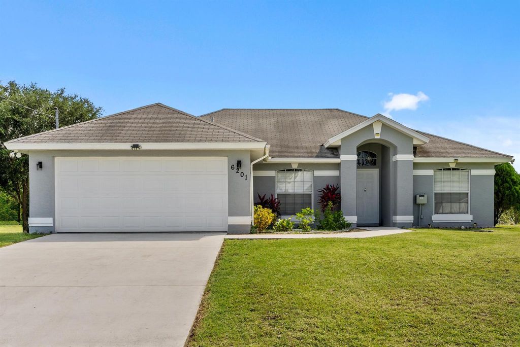 Photo of 6201 NW West Deville Circle, Port St Lucie, FL 34986 (MLS # R10895005)
