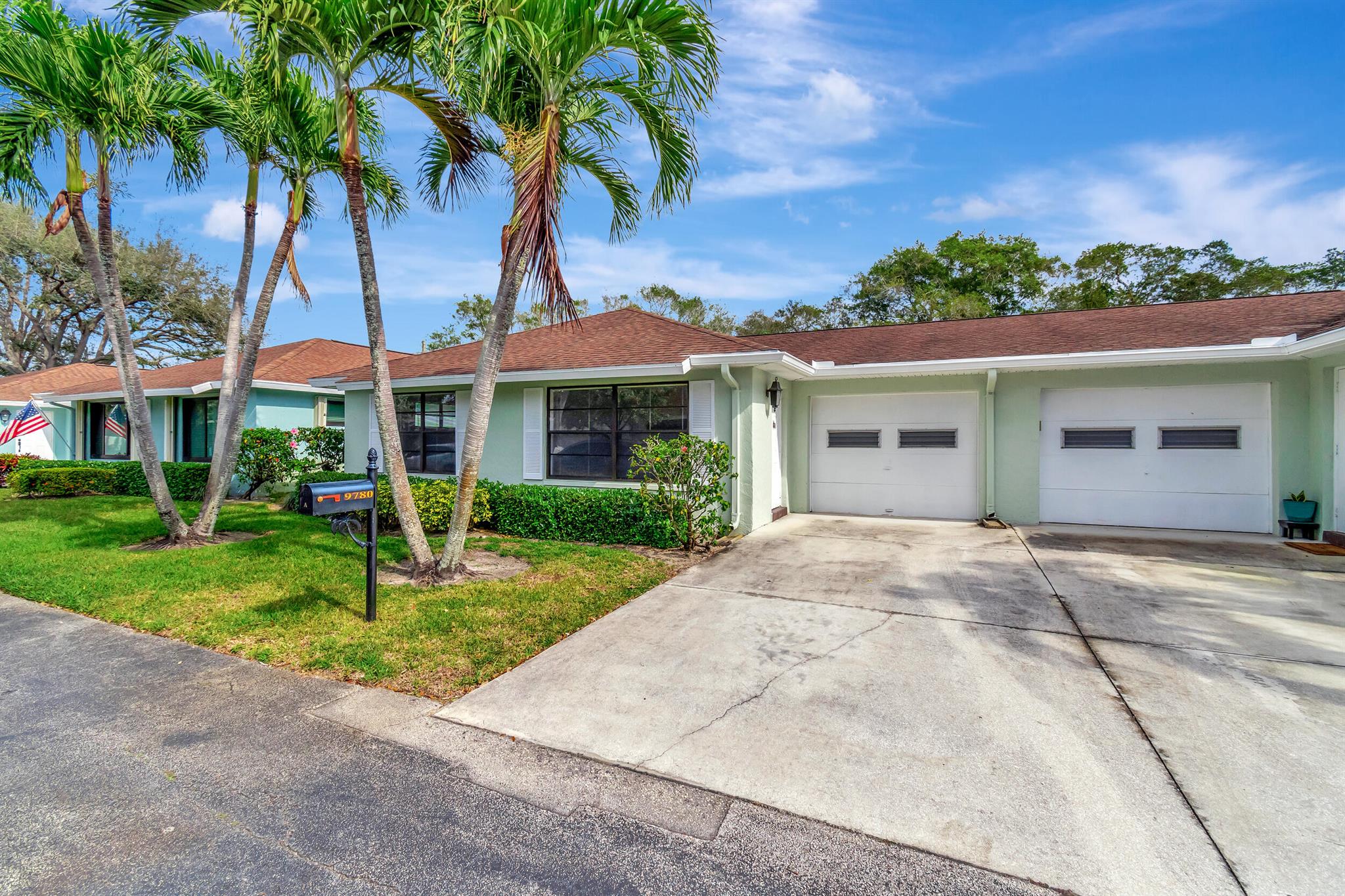 Completely updated 2 bedroom - 2 bathroom villa with a serene canal view plus a one car garage. This 1400 sq ft villa is a gem! Can be rented furnished or unfurnished. Contemporary designer kitchen with quartz counter tops, new SS appliances. Open concept living. Large format porcelain tile throughout. Smooth ceiling - No popcorn. Large master bedroom with walk in closet. HGTV inspired updated master bathroom with frameless glass shower and dual sink vanity. Lots of closet space. Screen enclosed patio plus additional paver for grilling. Rent includes water, cable. 55 plus adult community of Bent Tree Villas East features an active clubhouse with numerous social activities, pool & billiards.