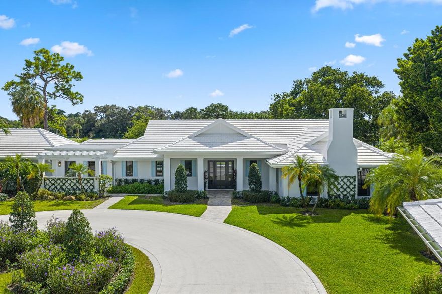 Thoughtfully designed with Bermuda Royale exterior detailing and refined Coastal Moderne interior finishes, this one-of-a-kind custom home offers elegant living with exceptional attention to detail. Grand open-concept living spaces feature soaring ceilings and expansive pocket sliders that open in both directions, seamlessly blending indoor and outdoor living with the lap pool, sundeck, and fountain just steps away. Ceilings throughout the home are maximized in height and adorned with custom rift-cut white oak beams, beautifully stained to highlight their natural character. These warm wood elements are paired with tongue-and-groove accents painted in a soft alabaster satin finish, creating a sophisticated contrast and visual harmony. The home features two luxurious primary suite options each with its own unique character. One showcases a serene golf course view, while the other offers a modern ambiance with a sultry, marble-wrapped fireplace. Both suites include spa-quality bathrooms with exotic marble finishes, wet room (tub/shower) designs, and custom-built closet systems.
The chef's kitchen is outfitted with a full Sub-Zero and Wolf appliance package, perfect for entertaining and everyday living. A stunning tiled bar area includes a backlit sommelier station, a built-in Sub-Zero wine fridge, and three additional under-counter refrigerators located throughout the home's multiple bar spaces.
With 4 bedrooms and 4.5 bathrooms in the main residence, the home also features impeccable lighting, designer trim, high-end flooring, and state-of-the-art mechanical systemsincluding all-new plumbing, electrical, gas, HVAC, and three tankless water heatersmaking this home better than new.
A beautifully matched detached guest house includes 1 bedroom, 1 full bathroom, and an oversized two-car garage with abundant storage, bringing the total to 5 bedrooms and 5.5 bathrooms.
Exterior highlights include a newly poured salted concrete circular driveway for easy access and generous parking, silver travertine patios and pool decks, and three pergola structures. Two feature operable roof systems positioned poolside with golf course viewscreating a striking visual presence from both inside the home and across the fairway.
This is more than a homeit's a statement of timeless design and quality craftsmanship. A rare opportunity to own a truly distinctive residence in an exceptional setting.