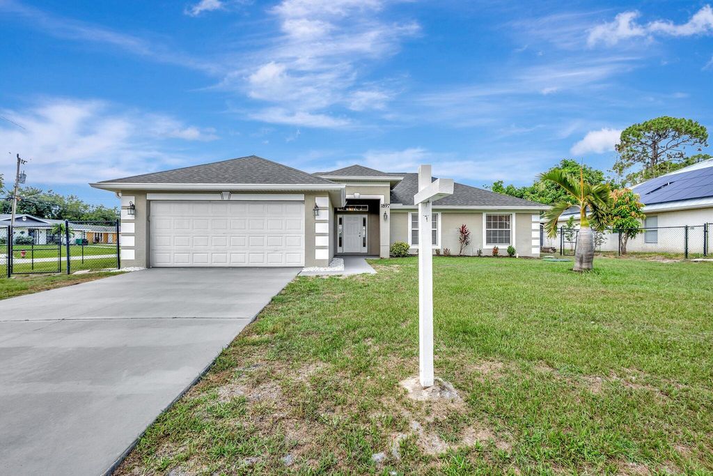 Photo of 1897 SW Lofgren Avenue, Port Saint Lucie, FL 34953 (MLS # R11093606)