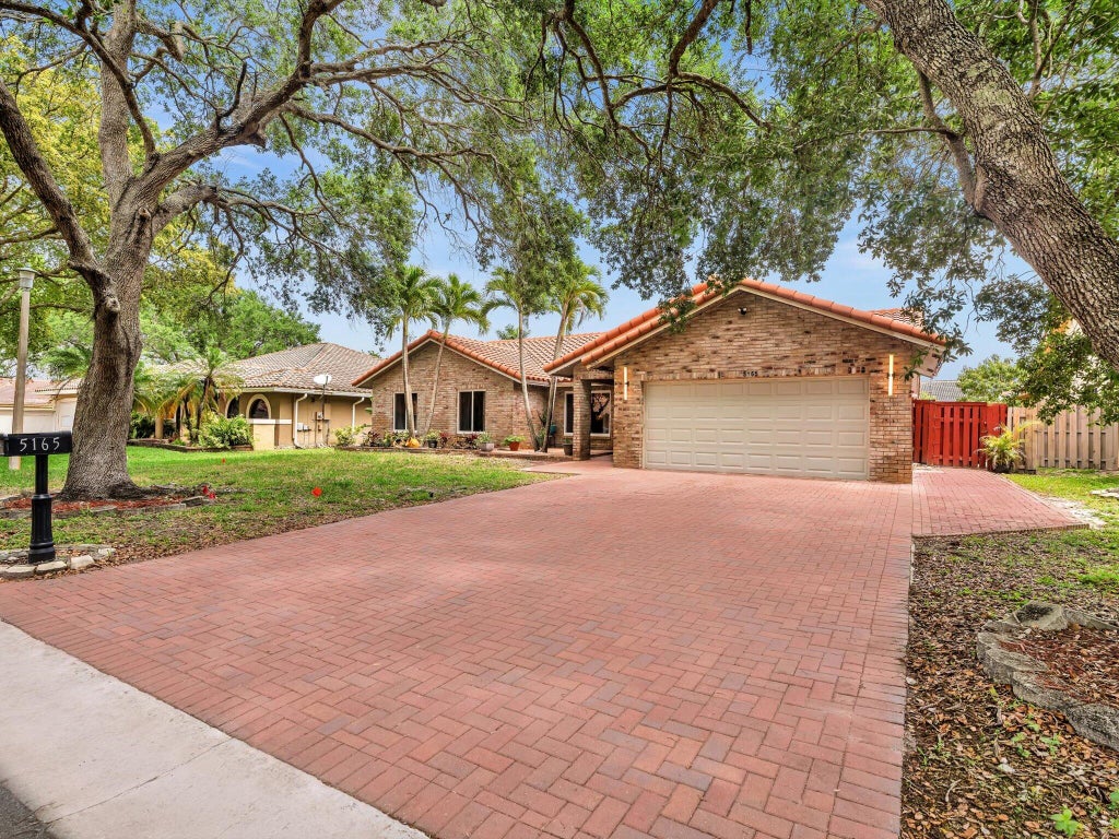 Photo of 5165 NW 99th Way, Coral Springs, FL 33076 (MLS # B26015000)