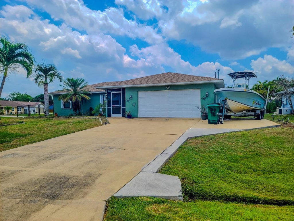 Photo of 2098 SW Libra Lane, Port Saint Lucie, FL 34984 (MLS # R11004866)