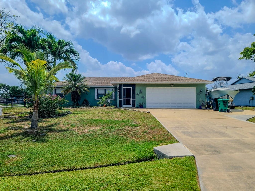 Photo of 2098 SW Libra Lane, Port Saint Lucie, FL 34984 (MLS # R11004866)