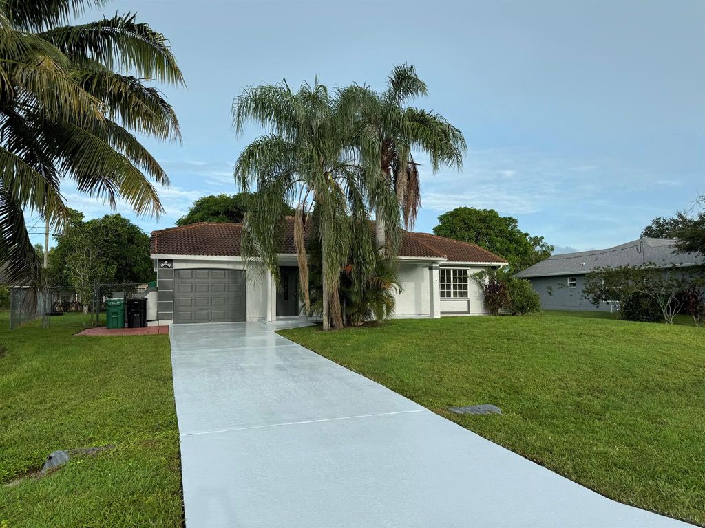 Photo of 109 SW Covington Road, Port Saint Lucie, FL 34953 (MLS # R11019144)