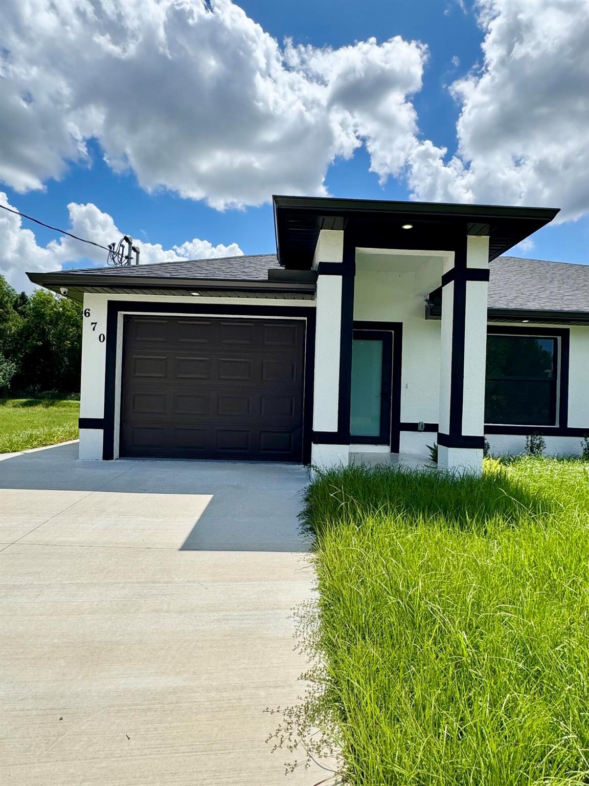 Brand new construction 3 bed/2 bath townhome/villa in Lehigh Acres (33974) -- AVAILABLE NOW! Modern open layout with high ceilings,luxury tile throughout, and stainless-steel appliances to be installed. Private garage plus driveway parking, irrigation system, and a spacious yard. Be the firstto live here! $2,200/month; move-in specials available--first, last & security negotiable. Vouchers welcome. Convenient to schools, shopping, and major roads.Schedule a tour today!