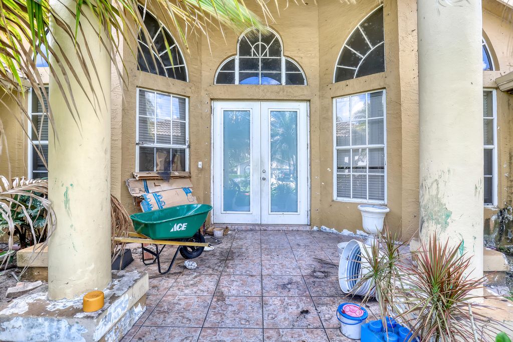 Photo of 1015 NE 3rd Street, Belle Glade, FL 33430 (MLS # B26030593)