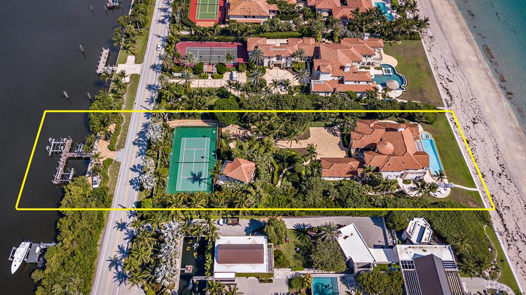 Magnificent direct ocean and intracoastal estate with a sprawling 150 feet +/- of beach frontage and almost 400 feet of depth allowing expansive outdoor space and privacy. This one-of-a-kind custom estate includes 5 bedrooms, 6 full and 1 half bathrooms along with a guest house. An entertainer's dream complete with open living areas, home theater, billiards room, artificial turf with 18-hole golf and tennis court. Breathtaking gardens with outdoor water features and seating areas, dining area, and oceanfront loggia with an infinity pool overlooking the Atlantic Ocean. Recent updates include the seawall, pool, fountains, dock, and gate. Brand new geothermal system on the 8 heating and cooling units.
