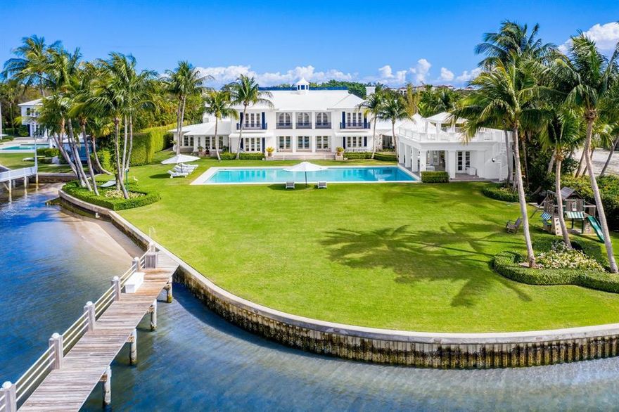 Introducing 319 N. Atlantic Drive, one of South Florida's most significant waterfront properties.  Nestled on 1.5  acres between the Intracoastal Waterway and the Atlantic Ocean and within minutes to the Forbes Five-Star rated Eau Resort & spa, this estate provides the ultimate level of privacy and convenience.Upon entering the main residence, one is greeted by a  double height foyer leading to the grand living room, seamlessly connecting all elements of the home with the outdoors and views of the water. The custom kitchen with vaulted ceilings is adjacent to the rotunda-like breakfast room with access to the outdoors.   The lush backyard oasis features an oversized rectangular swimming pool, poolside cabana with a rooftop terrace, multiple covered outdoor living spaces and a (cont