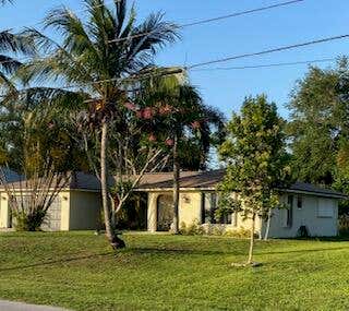Photo of 3951 SW CHERIBON Street, Port Saint Lucie, FL 34953 (MLS # B26064025)