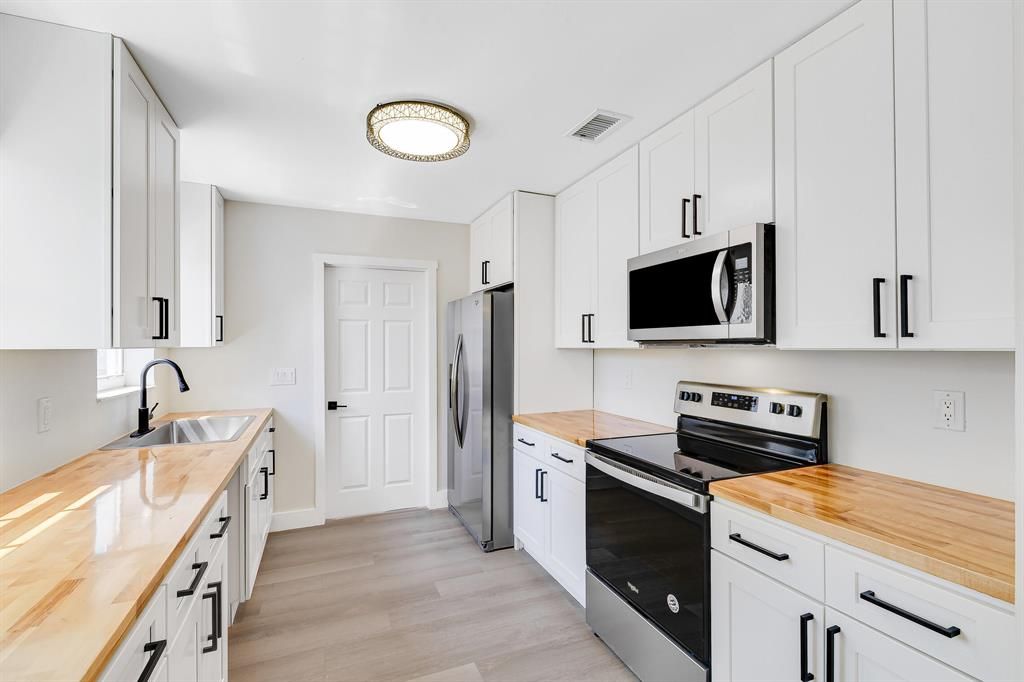 Photo of 728 W Kalmia Drive Dr, Lake Park, FL 33403 (MLS # R10703179)