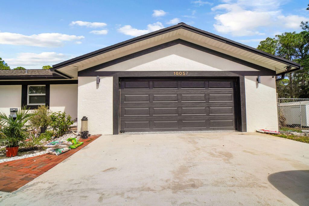 Photo of 18057 N 40th Run N, The Acreage, FL 33470 (MLS # B26015654)