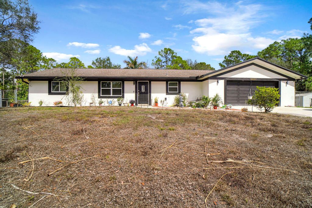 Photo of 18057 N 40th Run N, The Acreage, FL 33470 (MLS # B26015654)