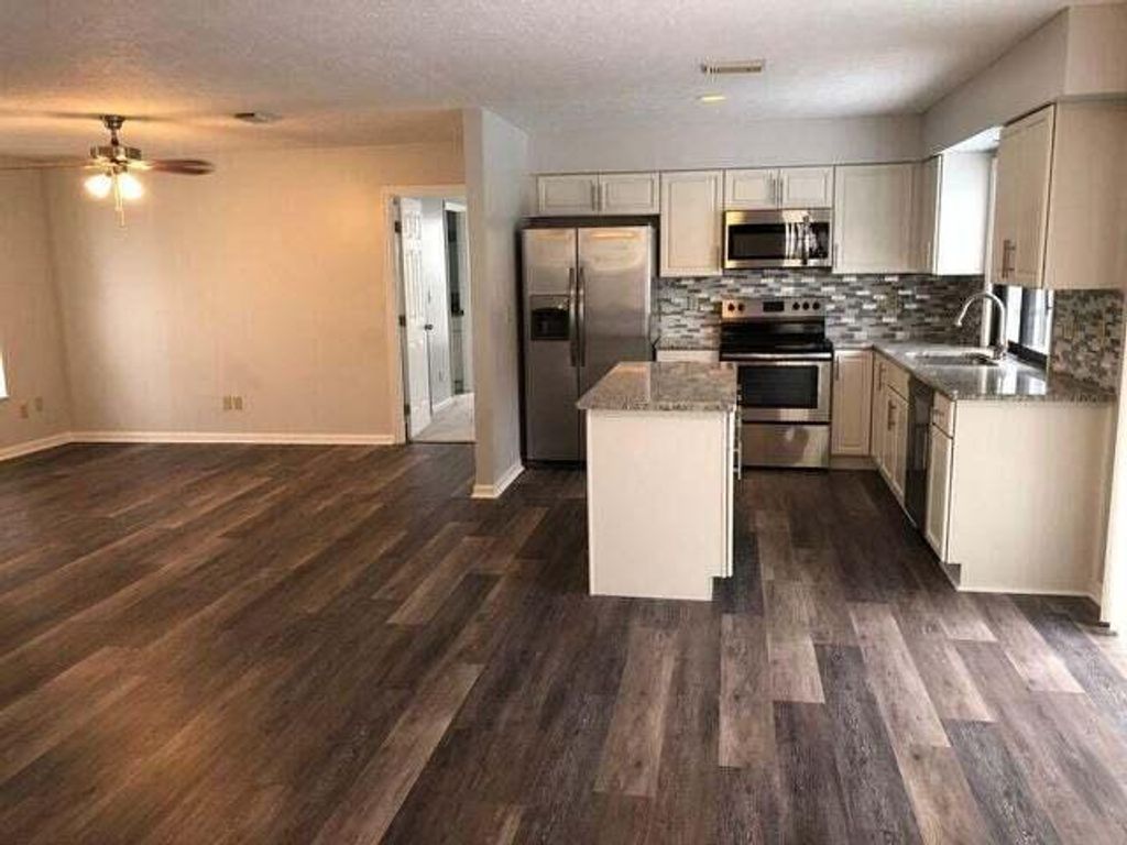 Photo of 2625 SW Monterrey Lane, Port Saint Lucie, FL 34953 (MLS # R10977157)