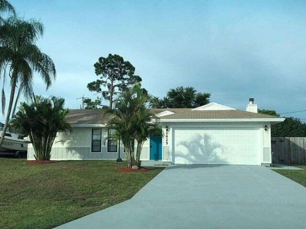 Photo of 2625 SW Monterrey Lane, Port Saint Lucie, FL 34953 (MLS # R10977157)