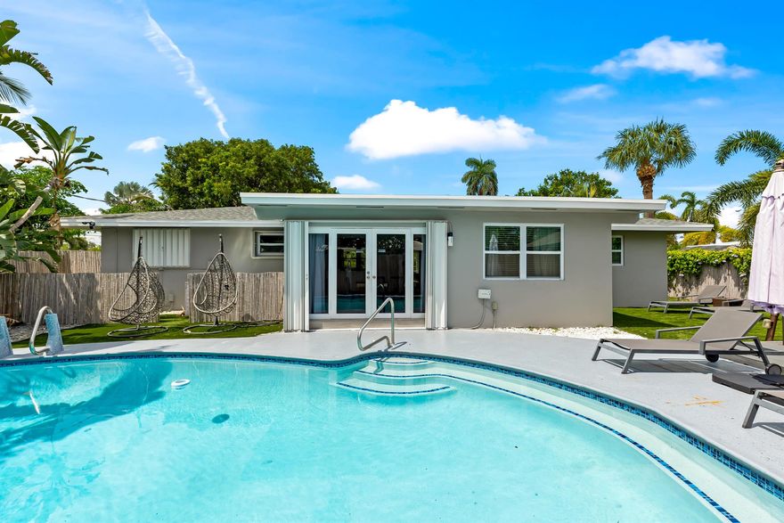 Just 5 minutes from the beach, this corner-lot gem (9,210 sqft) blends modern upgrades with Florida coastal charm. Recently remodeled, the home features a 2022 roof, new AC, impact garage door, updated plumbing, and updated electrical for true peace of mind. Step inside to discover 3 spacious bedrooms and 3 designer bathrooms, complemented by a sleek modern kitchen with quartz countertops, an oversized cooking island, and state-of-the-art appliances. Wide-open living spaces flow effortlessly to the outdoors, where bamboo fencing creates a private sanctuary. The backyard is an entertainer's dream: a sparkling pool, gazebo-shaded lounge, and an al-fresco dining area ready for unforgettable gatherings. Whether soaking up the sun or enjoying the ocean breeze, this home is the perfect retreat.