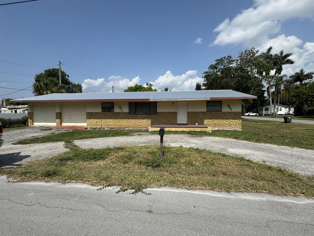 Photo of 601 NW 7th Street, Belle Glade, FL 33430 (MLS # R10987183)