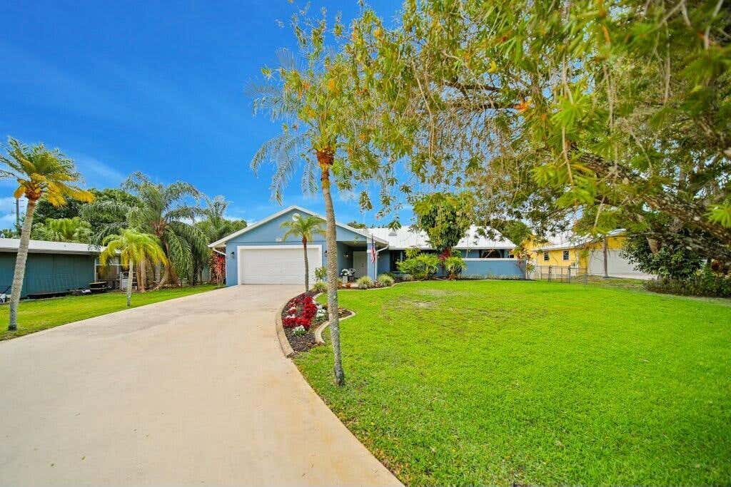 Photo of 870 SW Gardens Boulevard, Palm City, FL 34990 (MLS # R11079331)