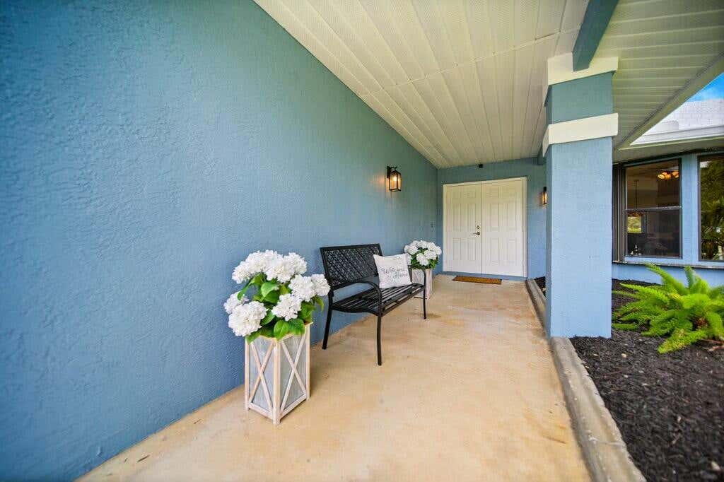 Photo of 870 SW Gardens Boulevard, Palm City, FL 34990 (MLS # R11079331)