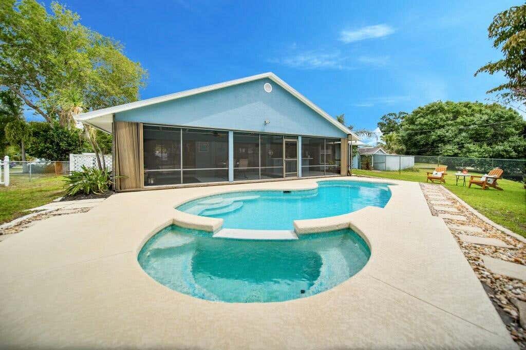 Photo of 870 SW Gardens Boulevard, Palm City, FL 34990 (MLS # R11079331)