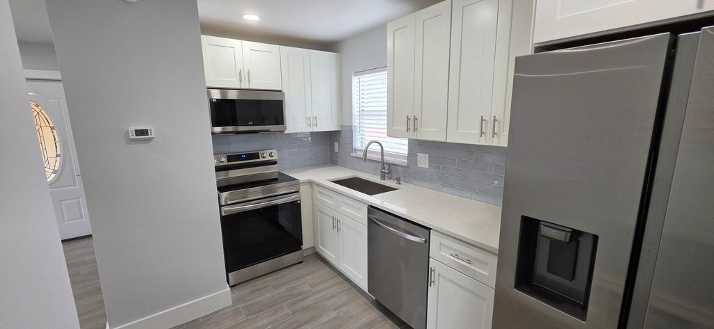 Photo of 351 Lake Dora Drive, West Palm Beach, FL 33411 (MLS # B26037196)
