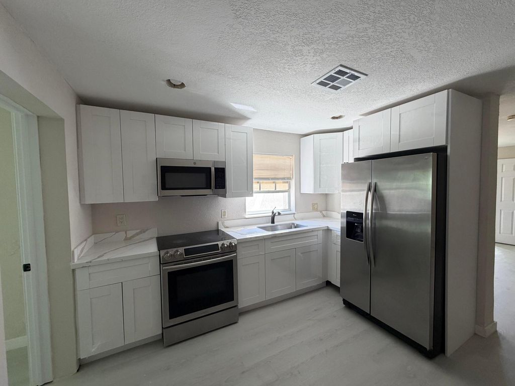 Photo of 472 NW 2nd Terrace, Deerfield Beach, FL 33441 (MLS # B26005507)