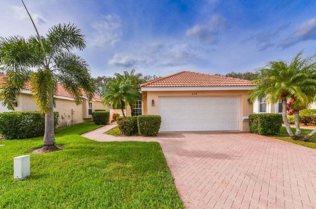 Photo of 650 SW Treasure Cove, Port St Lucie, FL 34986 (MLS # R10986552)