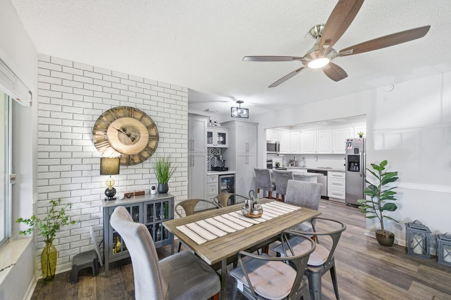 Welcome to La Pinata a 55+ community! This beautifully renovated and maintained 2-bedroom, 1.5-bath condo is ideally situated in a prime location just steps from the clubhouse and pool, offering both convenience and added privacy. Stylish décor has a neutral color palette with laminate flooring throughout and an updated kitchen designed to impress, featuring granite countertops, stainless steel appliances, a tiled backsplash, pull-out cabinetry and a dedicated coffee (or wine) bar. Enjoy year-round comfort and peace of mind with UV window film, which helps reduce heat and glare, protects furnishings from fading, and can improve energy efficiency. Accordion shutters on all windows provide quick and reliable storm protection which can help lower insurance costs. The second-floor location   offers additional advantages, including enhanced privacy, improved natural light, and added security, along with reduced exposure to ground-level moisture. Major updates include a new roof (2025) and water heater (2025), with the A/C replaced in 2017 and a newer electrical panel already in place. Recessed lighting adds a modern touch throughout the home. The bedrooms both features walk-in closets, while the bathroom includes a convenient step-in shower. Washer  Dryer are located in the walk in closet off kitchen with additional shelving for pantry items or extra storage space.  Relax on your private enclosed patio with a storage closet for extra convenience. Furniture is negotiable, making this a truly move-in-ready opportunity.