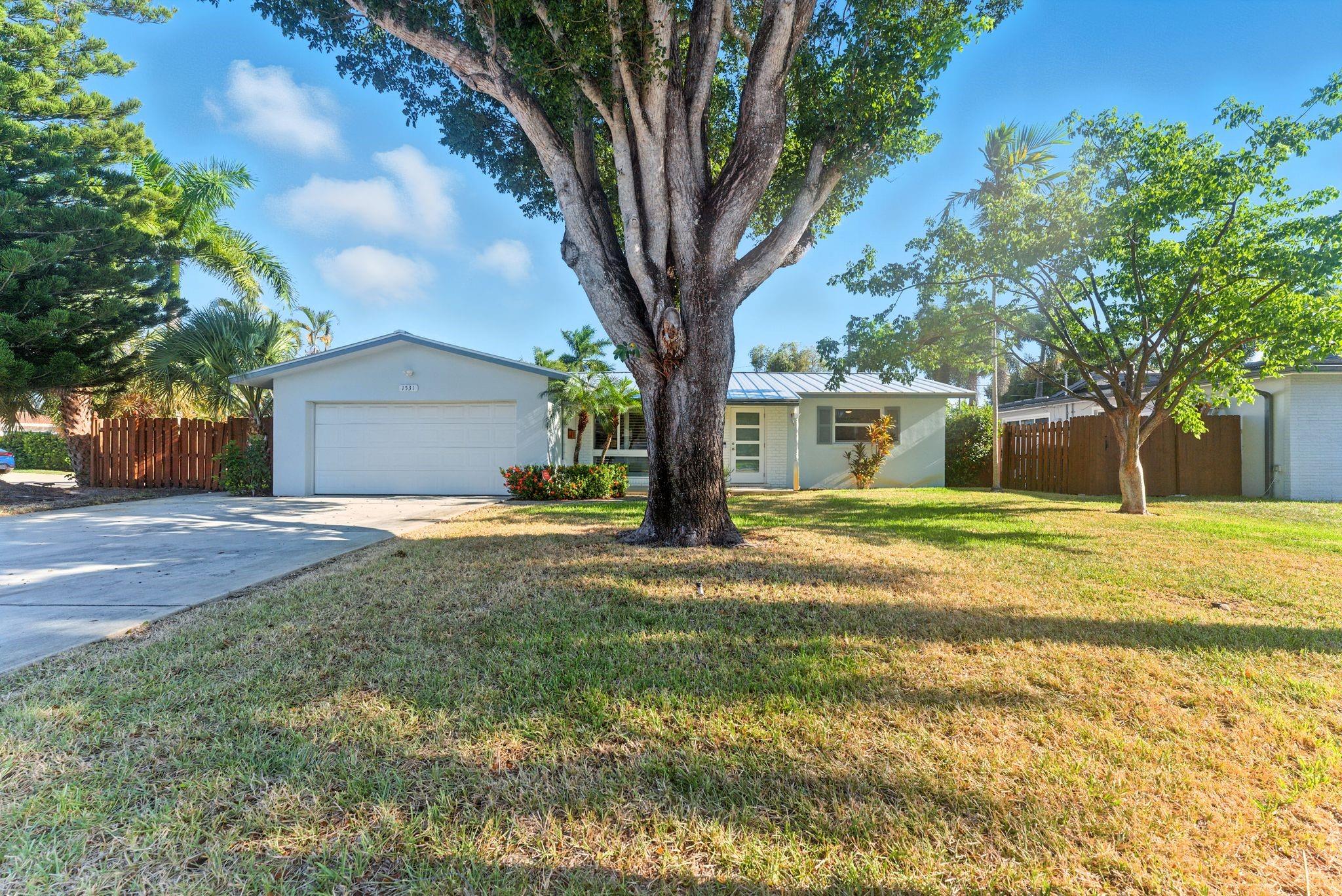 Experience modern living in this fully renovated 2-bedroom, 2-bathroom home with a 2-car garage. Sitting proudly on a corner lot in Coral Ridge Isles, this residence showcases a diamond-bright pool and a long list of brand-new upgrades: sleek modern kitchen, updated flooring, spa-inspired bathrooms, impact windows and doors, stylish fixtures, and a new metal roof. Enjoy peace of mind with no HOA or rental restrictions, and unbeatable convenience. Just minutes from the beach, shopping, dining, and I-95.