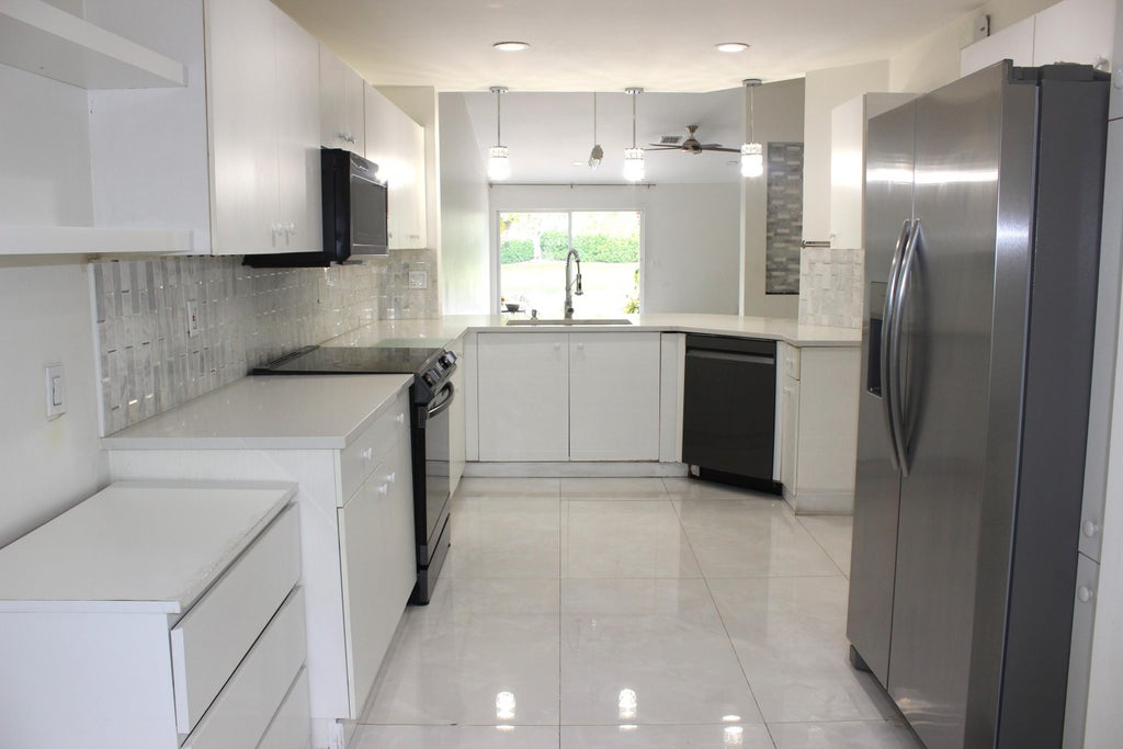 Photo of 1590 ORION Lane, Weston, FL 33327 (MLS # B26058339)