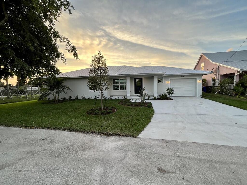 Photo of 5580 SE Colee Avenue, Stuart, FL 34997 (MLS # R10940178)