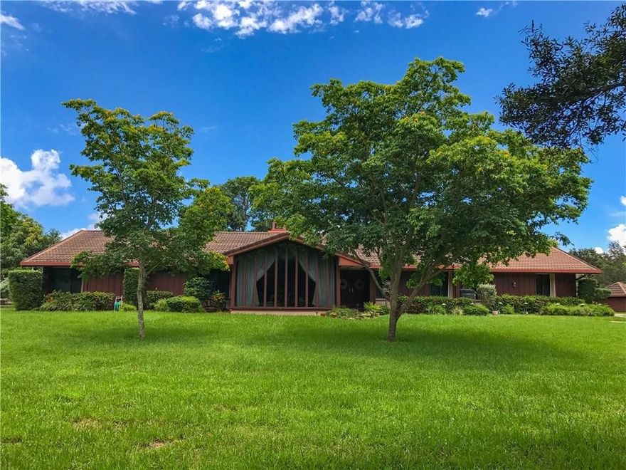 ***TUCKED AWAY AND HIDDEN IN HIATUS ISLES - ONE OF DAVIE'S UNDISCLOSED COMMUNITIES!!!***THROUGH SEVERAL WINDY ROADS, THIS COUNTRY SCENERY LEADS YOU TO AN OVER-SIZED 1.53 ACRE CORNER-LAKE FRONT LOT. ENCIRCLED BY MATURE OAK TREES, WHICH MARK THE PERIMETER, THERE IS A WOODEN DOCK IN THE BACK W/WIDE WATER VIEWS...PERFECT FOR THE KIDS TO FISH THE NIGHT AWAY. SPACIOUS 2 CAR GARAGE, WOOD BURNING FIREPLACE, METAL ROOF (8 YEARS OLD), NEWER A/C'S, CITY WATER W/UNDERGROUND UTILITIES, SEPTIC TANK ONLY 3 YEARS OLD.