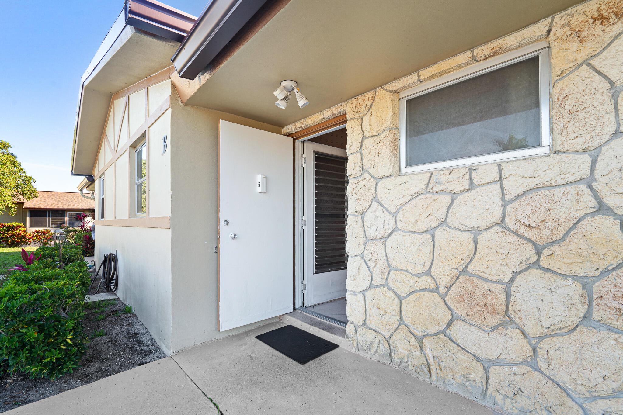 Discover the best of South Florida living in this inviting 2-bedroom, 2-bath villa! Both bedrooms feature spacious, full-wall closets, with an additional large storage closet located on the back porch. Enjoy the enclosed, extended open patio that backs onto a peaceful greenbelt--perfect for relaxing or entertaining. The community offers a variety of resort-style amenities, including a gym, sauna, woodshop, SALT WATER POOL, shuffleboard, billiard room, and more--ensuring there's always something to enjoy. Conveniently located in a friendly 55+ community, you'll have easy access to shopping, dining, beautiful beaches, and be just minutes from Palm Beach Airport.