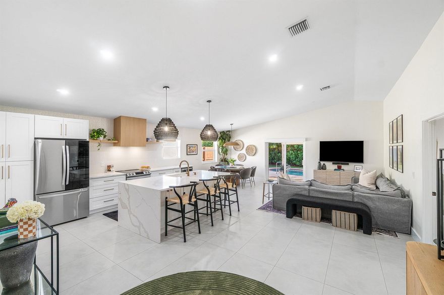 Welcome to this completely renovated Delray Beach retreat, offering modern living and relaxed coastal style less than two miles from vibrant Downtown Delray. This light, bright home features an open-concept design that seamlessly connects the living, dining, and kitchen areas--perfect for both everyday living and effortless entertaining.No detail was overlooked in the renovation. The home boasts a stunning kitchen with quartz countertops, new white cabinetry, and brand-new Samsung kitchen appliances. The updates continue with beautifully remodeled bathrooms, new tile flooring throughout, solid core doors, built in closet systems and a built-in laundry area featuring custom cabinetry, a matching quartz countertop, and a new washer and dryer.