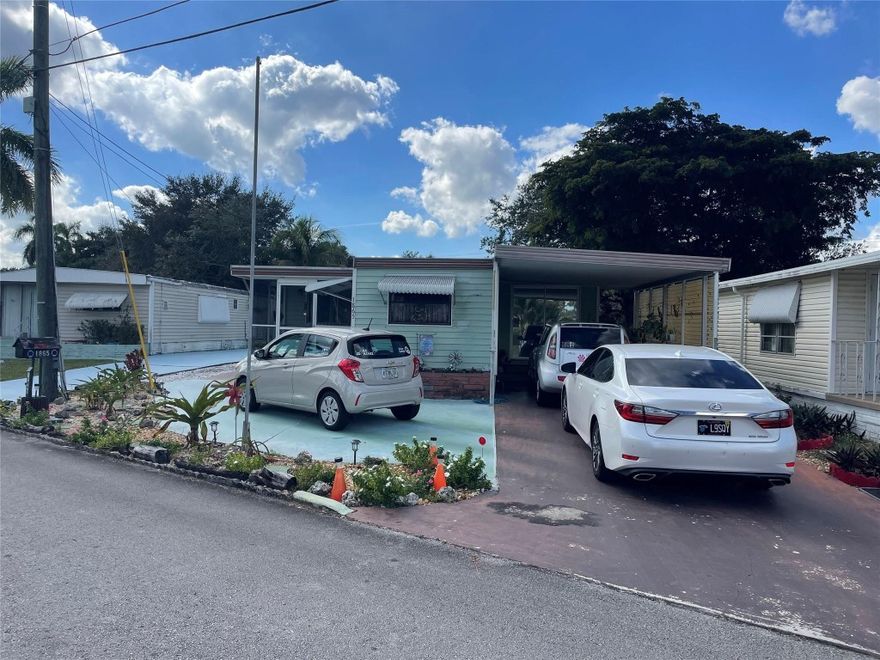 Absolutely gorgeous 2/2 with carport - shed - screened in porch - on oversized lot with canal in back of home - beautiful flooring through out - -central air few years - -has the feel of a double wide - eat in kitchen - huge Florida/Family room - great curb appeal - -assoc. states it is HOPA verified - -priced right for quick sale - truly a must see.........