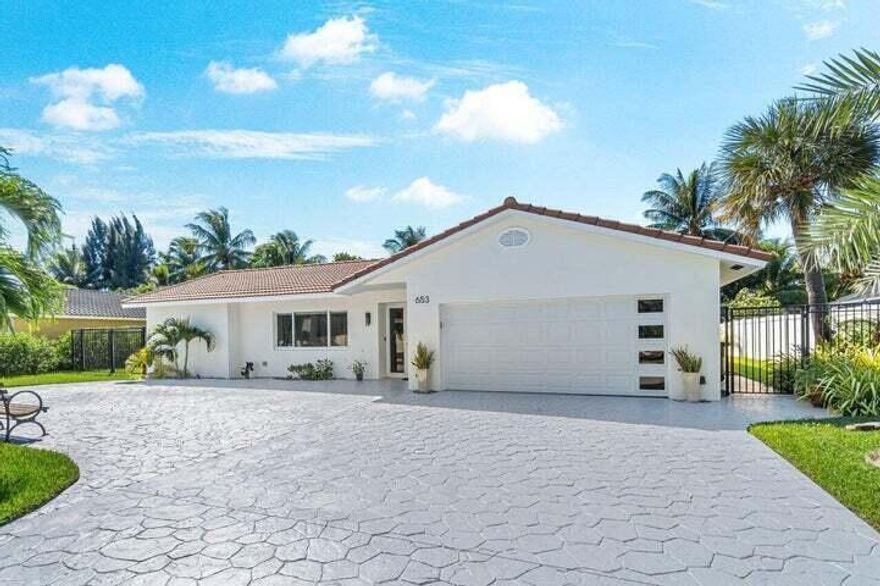 The perfect home in Lake Floresta Park Enjoy a BRAND NEW LUX POOL or take the kayaks out on the canal in your backyard with access to a lake. This is the perfect 3 bedroom / 2 bath split floor plan layout with tons of yard space for activities. Property features a two car garage with a large circular driveway and all impact glass and doors. You will be just minutes to Mizner Park, Royal Palm Place, grocery stores and the beach! .